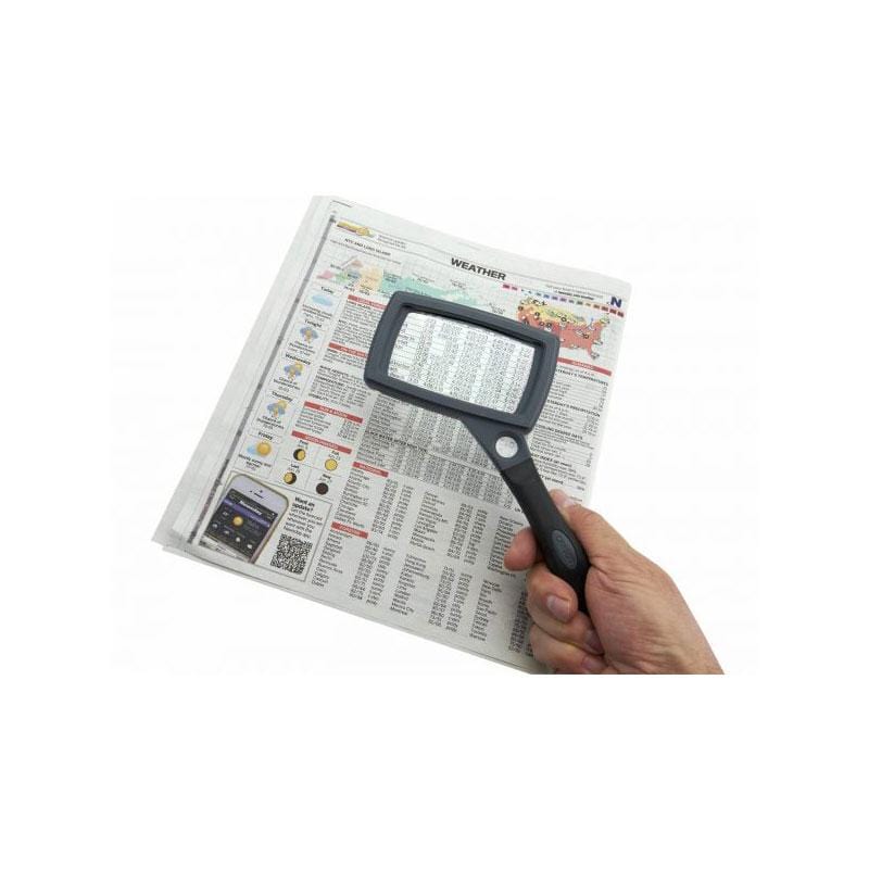 Carson SureGrip 2x Hand Magnifier with 10x Spot Lens and Stand in use