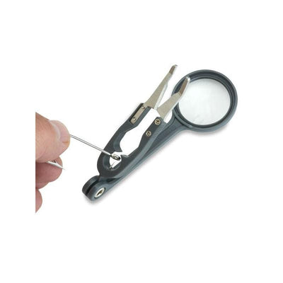 Carson Fish'n Grip 4.5x Magnifier with attached precision tweezers, hook cleaner and line cutter in use