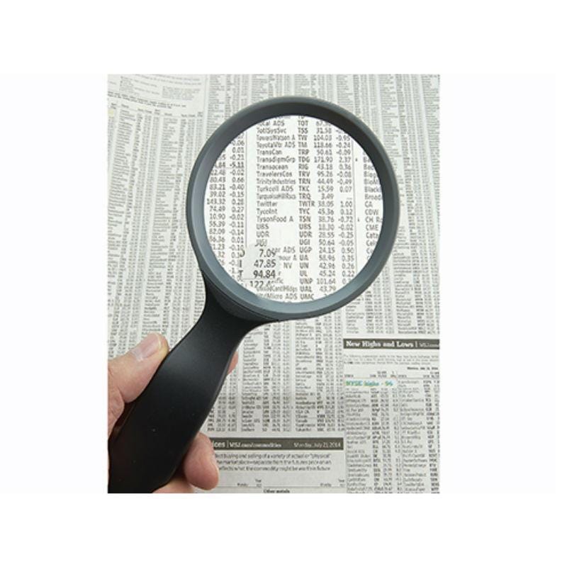 Carson HandHeld 2x Hand Magnifier with 4.5x Spot Magnifier with newspaper