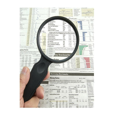 Carson MagniView 2x Hand Magnifier with 4.5x Spot Lens with newspaper